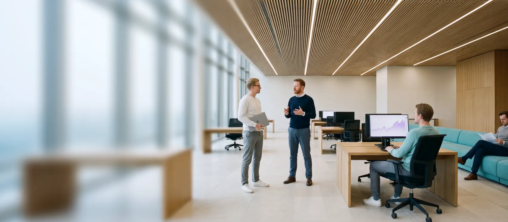 A team working at desks in a bright open-plan office